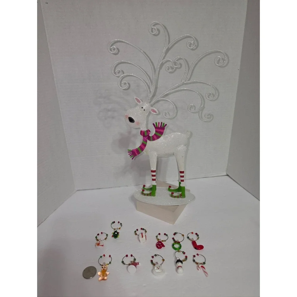 Pier 1 Imports reindeer wine charm‎ set featuring a decorative metal stand